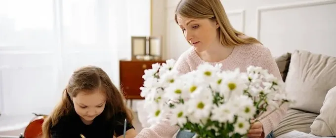Parent supporting her child to study Pre Algebra